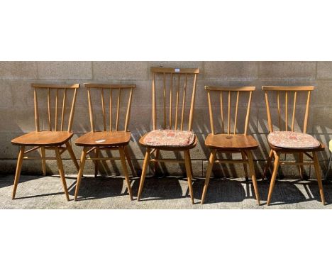 Four mid-20th century Ercol dining chairs, each with five spindle back and gold labels; together with a similar Ercol dining 