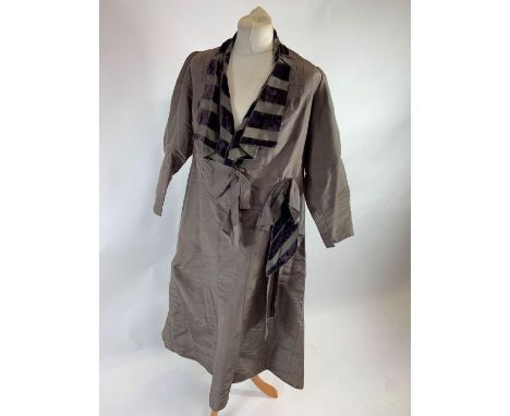 An early 20th century ladies coat, in a light greyish purple, with decorative striped velvet collar and silk lining, no size