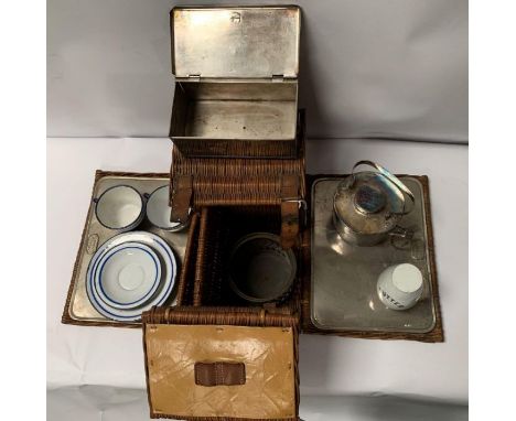 An early to mid 20th century wicker picnic basket and contents 'The Overland' Rd 145129; the contents to include enamel dishe