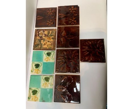 A 20th century tile with transfer printed decoration of flowers, with a Staffordshire knot type mark to the back, 15.3cm x 15