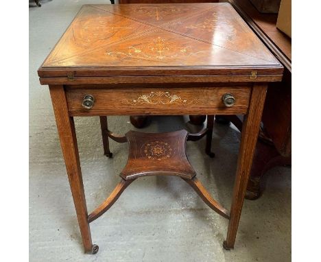 A 19th/20th century mahogany, square envelope card table, with single drawer, on four tapering legs with casters, and lower t