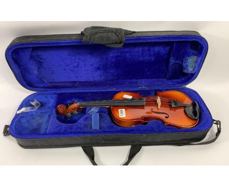A 20th century unnamed violin, body 35.7cm long not including button, in a modern soft case 