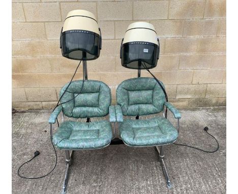 A pair of vintage hairdressers chairs, upholstered in a mottled green vinyl, joined together at the base, together with two P