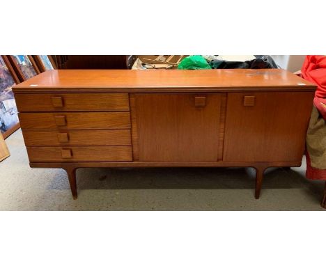 A mid-20th century teak Austin Suite sideboard, with four short drawers to one side, a central fall front section with single