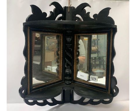 A Victorian ebonised corner wall mirror and shelf, with gilt borders, 55cm high