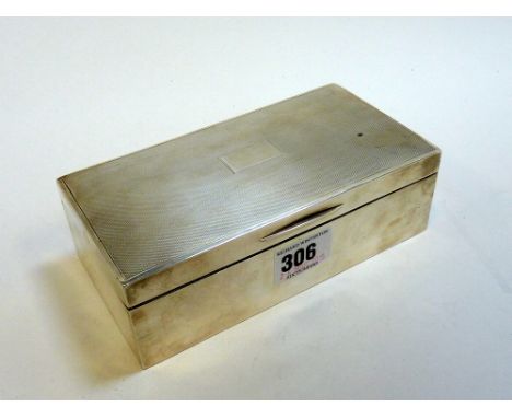 A SILVER CIGARETTE BOX, Birmingham 1947, rectangular shape with engine turned top and walnut lining, 16.5cm across, gross app