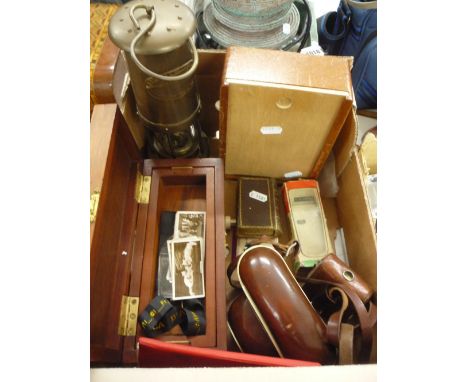 A SMALL BOX OF SUNDRIES, miners lamp, camera etc