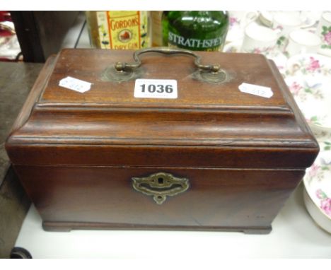 A MAHOGANY TEA CADDY, with secret drawer, brass mounted carry handle