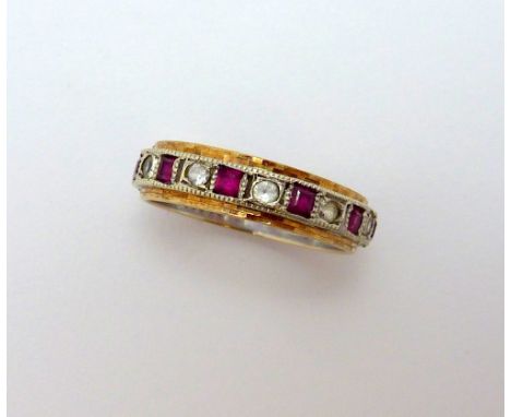 A 9CT GOLD RUBY AND DIAMOND BAND RING, with square shape rubies with single cut diamonds to the bi-coloured band, hallmarks f