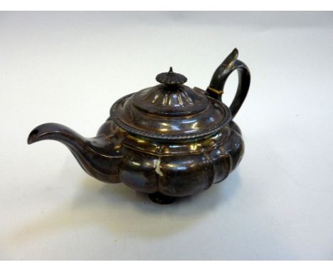 A GEORGE III SILVER TEAPOT, Jonathan Hayne, London 1787, of lobed compressed globe form raised on moulded acanthus scroll fee