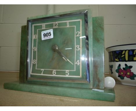AN ELECTRIC ONYX MANTEL CLOCK