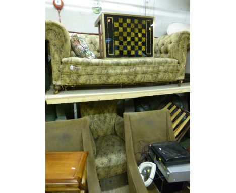 A VICTORIAN UPHOLSTERED CHESTERFIELD SOFA, and a matching armchair (2)