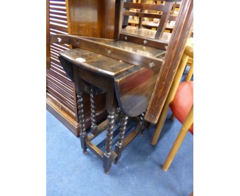 A SMALL OAK BARLEY TWIST GATE LEG TABLE