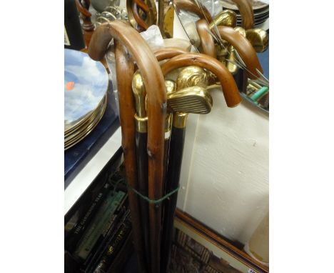 A BUNDLE OF WALKING STICKS, and a box of novelty walking stick handles shaped as dog heads etc