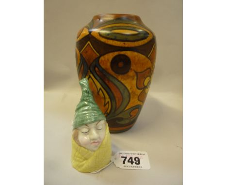 A ROYAL WORCESTER 'MR CAUDLE' CANDLE SNUFFER, and a Chameleon Ware vase (2)