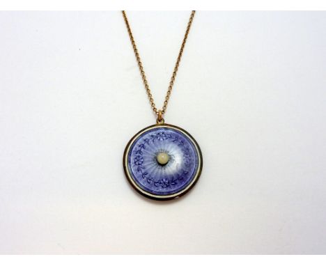 AN EDWARDAIN LOCKET, with central pearl within a surround of purple guilloche enamel, with reverse a picture of a gentleman w