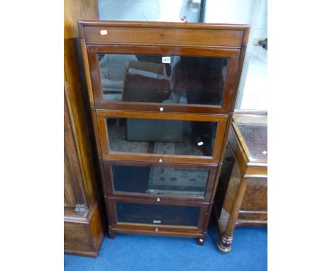 A MAHOGANY GLOBE WERNICKE STYLE GLAZED FOUR SECTION BOOKCASE