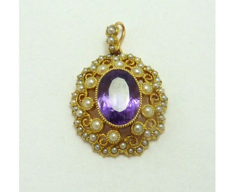 AN EARLY TWENTIETH CENTURY AMETHYST PENDANT, with central oval amethyst with scrolling pearl surround further to the pearl ba