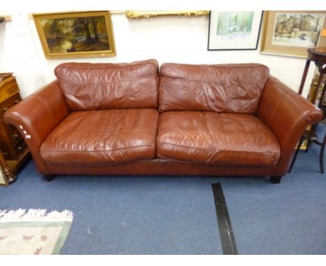 A LARGE BROWN LEATHER TWO SEATER SOFA