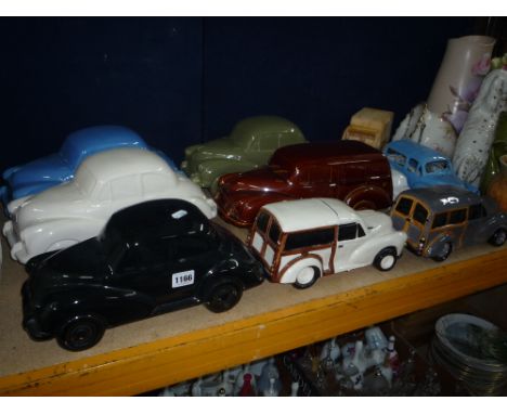 TEN VARIOUS CERAMIC/WOODEN 'MORRIS MINOR' MODEL CARS, (one night light)
