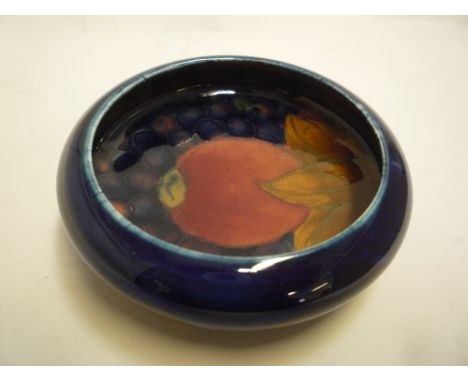A MOORCROFT POTTERY TRINKET DISH, Pomegranate pattern, impressed marks, diameter 11cm