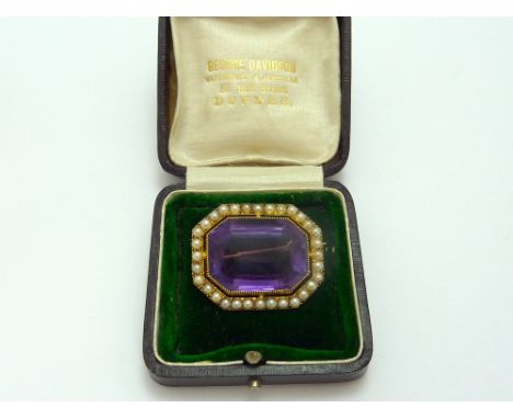 A VICTORIAN BROOCH, with large amethyst within a surround of pearls, to reverse engraving Mrs McNab, within antique box