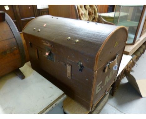 A DOME TOP TRAVELLING TRUNK, initialled E.M.W. to each end (s.d.)