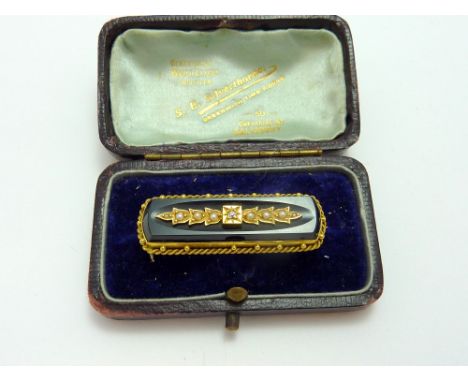 A VICTORIAN MEMORIAL BROOCH, with central old cut diamond with blue bell shaped petals with split pearls within a rope twist 