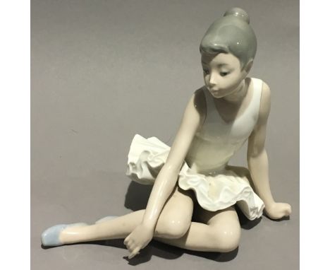 A Nao figure of a ballerina at rest