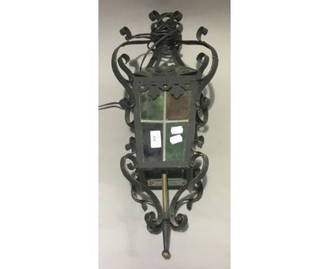 A vintage hanging lantern lamp, with coloured glass panels