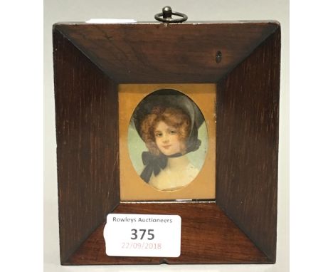 A small 19th century rosewood frame with portrait print