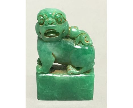 A Chinese carved jade fo dog seal