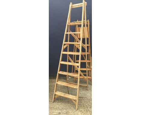Two vintage wooden step ladders