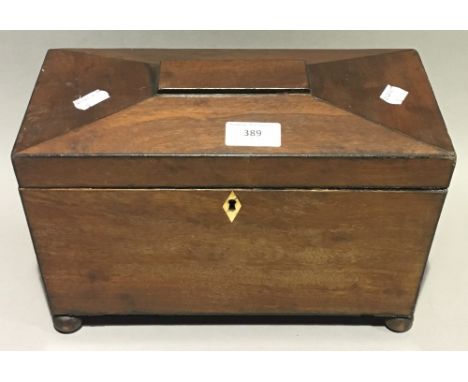 A Victorian mahogany sarcophagus tea caddy