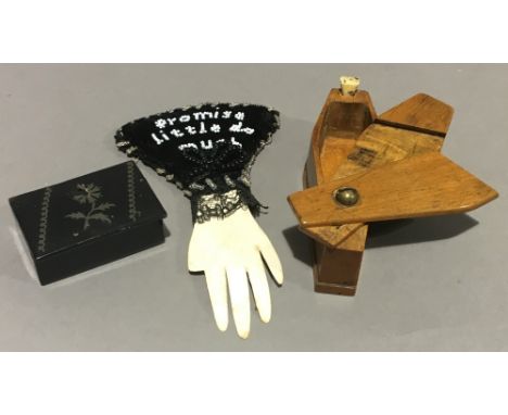 A papier mache snuff box with floral design, a 19th century pin cushion inscribed ''Promise Little Do Much'' and a boxwood co