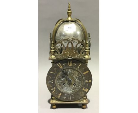 A brass lantern clock