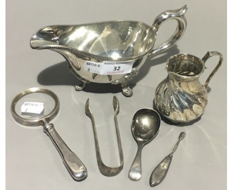 A silver magnifying glass, a silver caddy spoon, a silver snuff spoon and three pieces of silver plate
