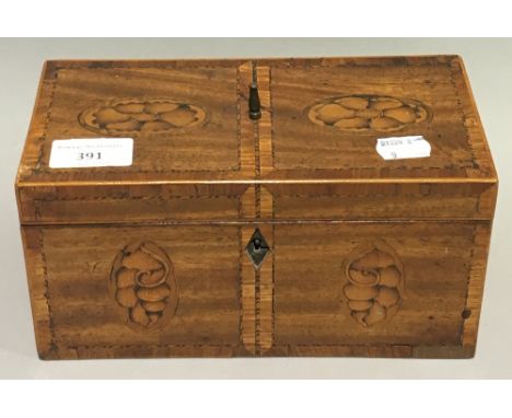 A 19th century inlaid mahogany tea caddy