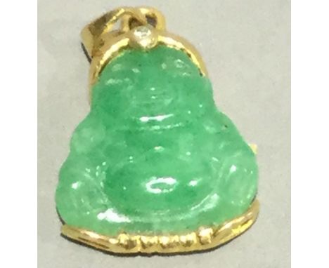 A carved jade Buddha pendant