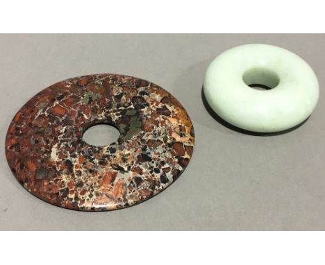 A Chinese jade roundel and a small bi disc