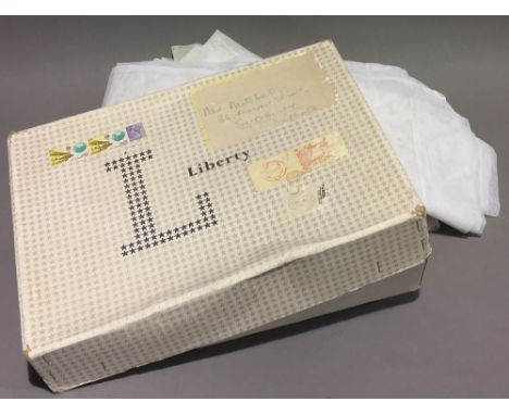 A Liberty box containing a quantity of net curtains