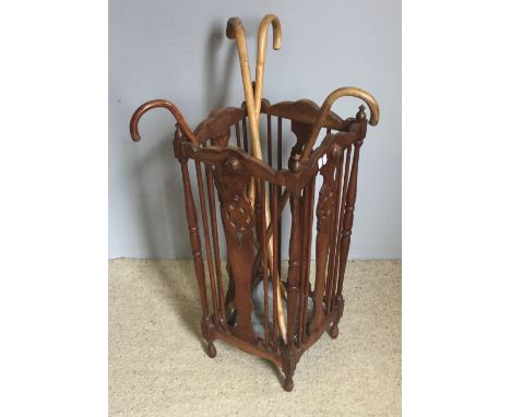 A carved wooden stick stand