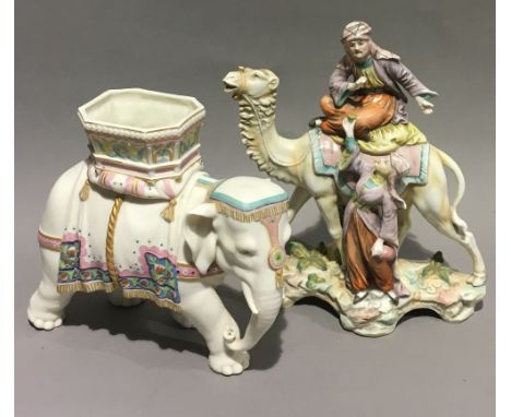 A Royal Worcester porcelain vase formed as an elephant, together with a Continental porcelain group of figures with a camel