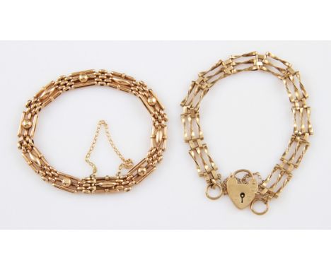 A 9ct yellow gold gate bracelet, three links wide of twisted design, with heart padlock clasp, complete with safety chain, br