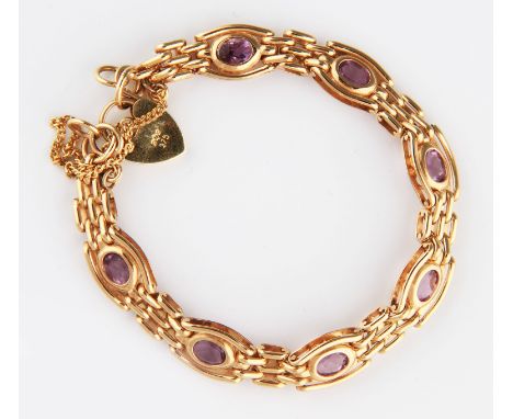 A 9ct yellow gold amethyst gate bracelet, three links wide and rub over set with seven oval cut amethysts, each measuring app