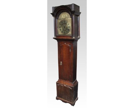 A 19th Century oak long case clock, with pie crust topped front panel and door with two column supports to head, the brass fa