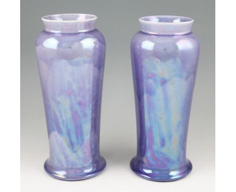 A pair of Ruskin pottery vases of shouldered form with lavender lustre glazes, both factory made single central holes to base