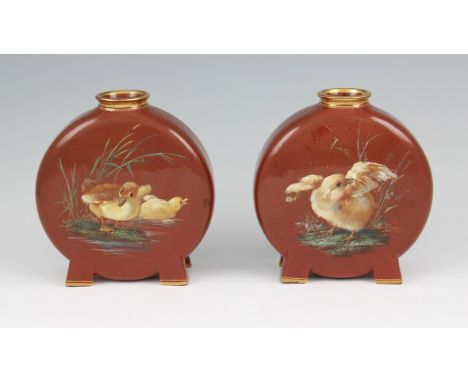 A pair of aesthetic Minton's earthenware moon flask vases decorated with hand painted duckling designs, both shape number 130