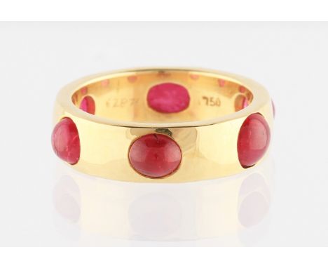 A yellow metal ruby ring, set with six ruby cabochons to entire band, band width approx. 5mm, stamped 750, ring size H, weigh