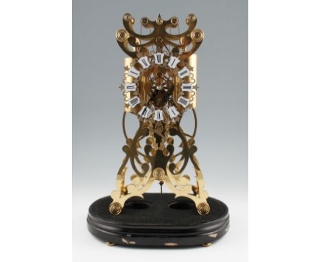 A 20th Century 8 day brass bodied skeleton clock with twin weight pendulum movement having an open work ornate frame design, 